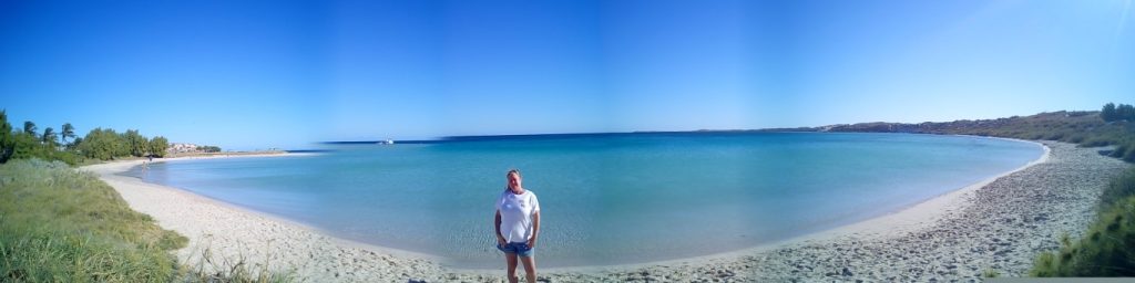 Coral bay panoramic photo of the beach and aqua blue waters 