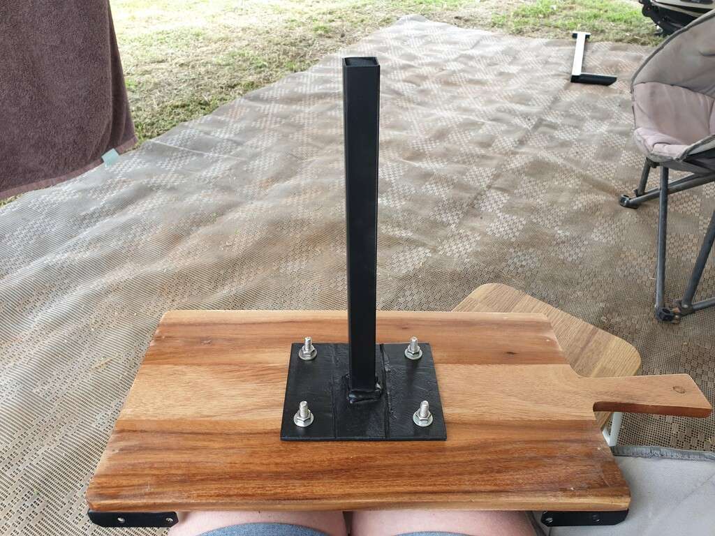 making a DIY caravan BBQ Table screwing base on table