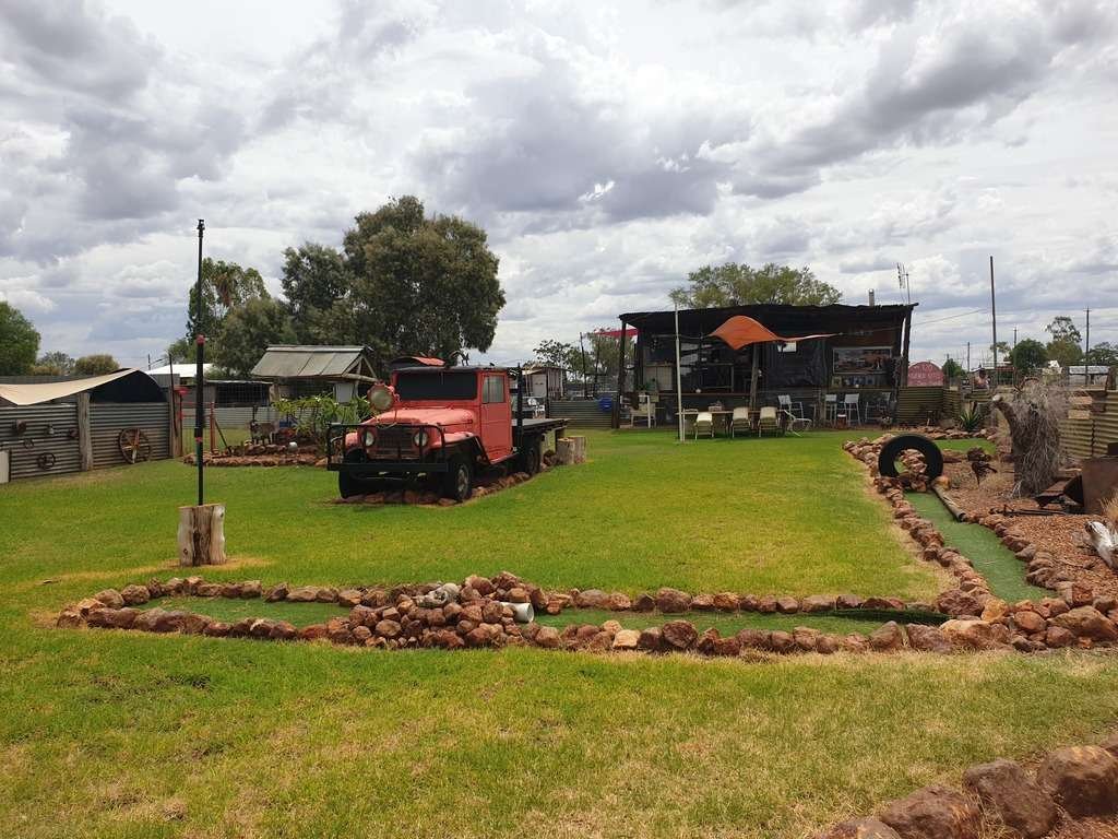Old car funky garden at post office store caravan park