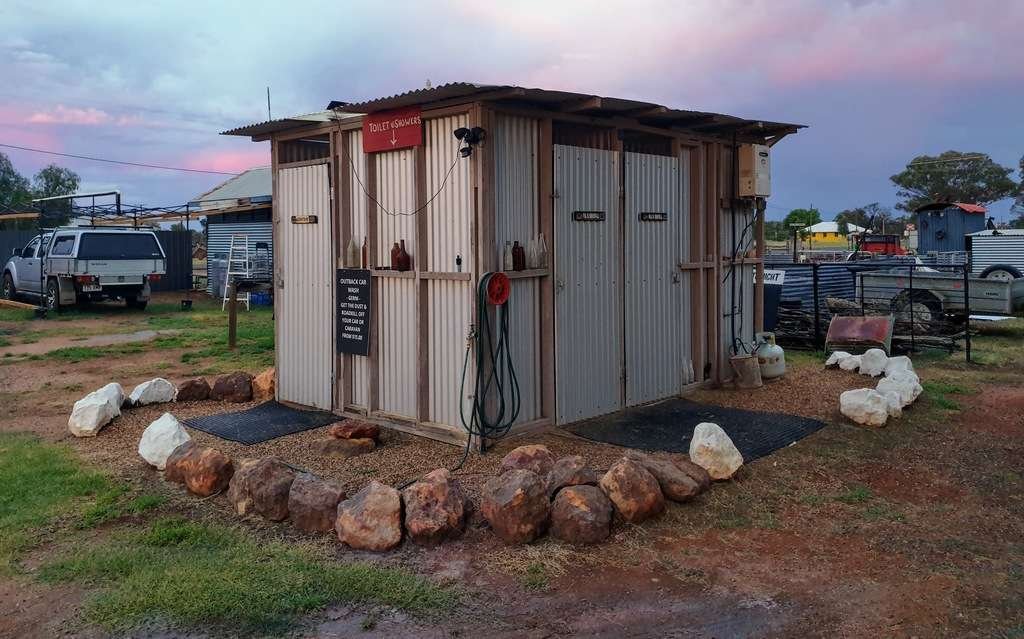 Wyandra post office store camp caravan park Queensland at sunset with caravan Amenities block