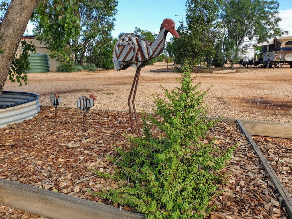 Emu metal art in the caravan park gardens