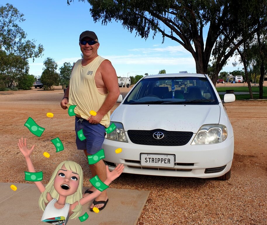 full time caravanning next to car with funny number plate